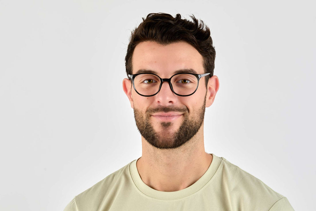 Man wearing Serene Black, Oval Black Acetate Glasses