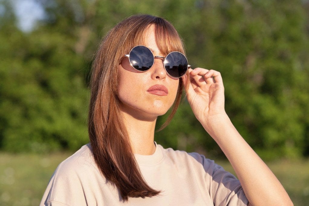 Woman wearing Lennon, John Lennon Round Sunglasses