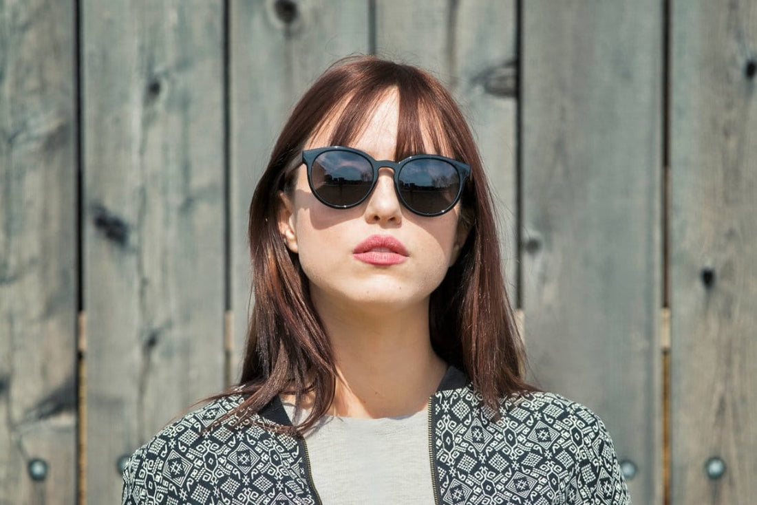 Woman wearing Luxy, Black Round Polarized Sunglasses