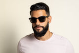 Man wearing Oxford, Polarized Square Wood Sunglasses